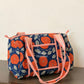 Orange Floral Quilted Mini Duffle Bag